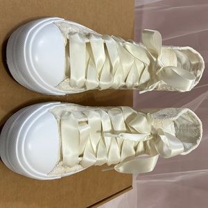 Unbranded high top ivory lace covered high top shoes. Great for wedding shoes.